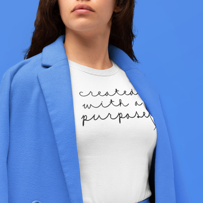 created-with-a-purpose-white-t-shirt-mockup-featuring-a-serious-looking-woman-at-a-studio