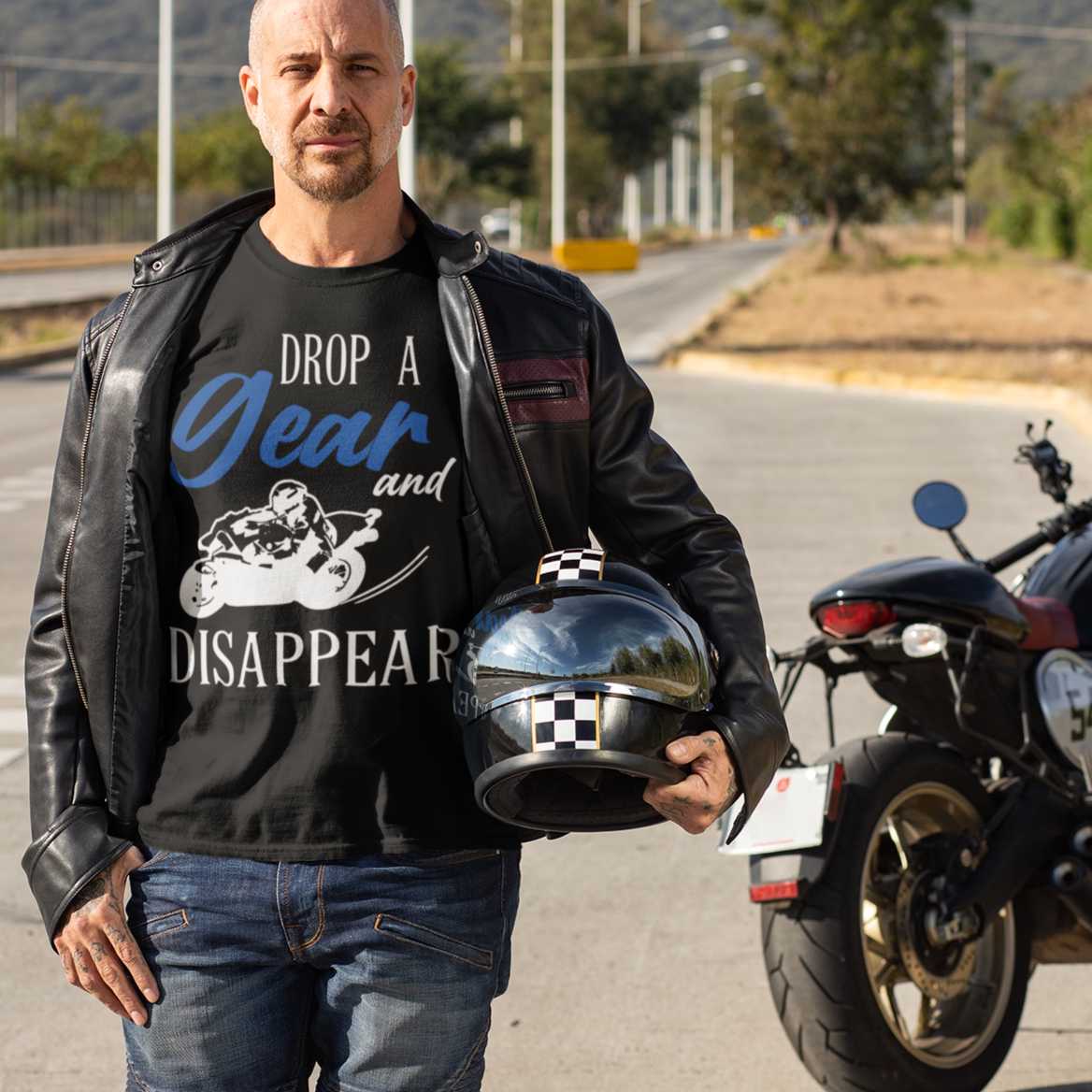 drop-a-gear-and-disappear-t-shirt-mockup-featuring-a-biker-posing-near-his-motorcycle