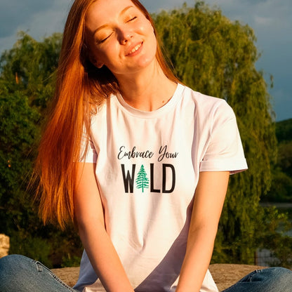 embrace-your-wild-with-tree-graphic-soft-cream-t-shirt-womens-outdoors-mockup-of-a-woman-enjoying-nature