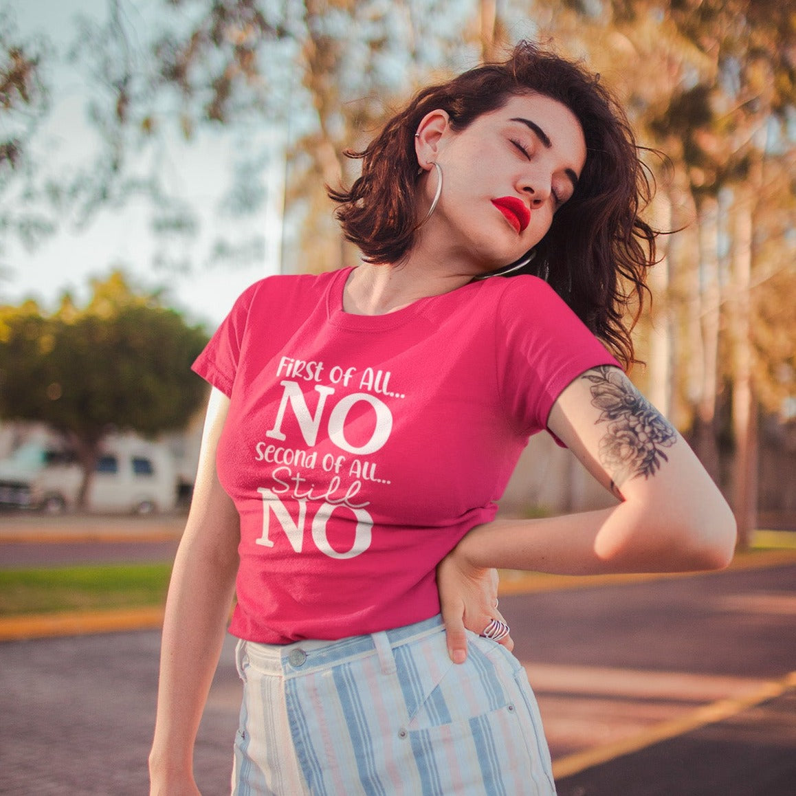 first-of-all-no-second-of-all-no-berry-t-shirt-sarcastic-women-mockup-featuring-a-fashion-forward-woman-in-the-a-street
