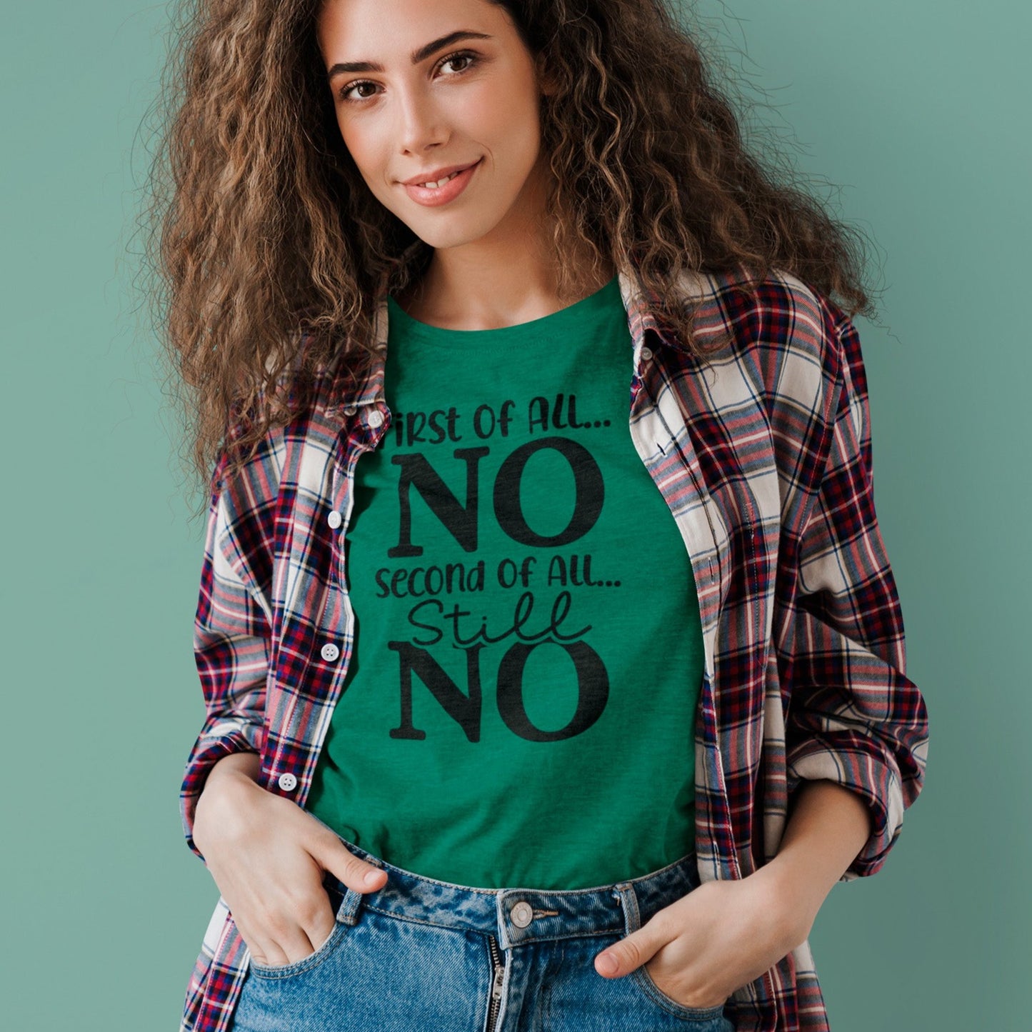 first-of-all-no-second-of-all-no-heather-kelly-green-t-shirt-sarcastic-women-mockup-of-a-curly-haired-woman-wearing-a-t-shirt-under-a-flannel-