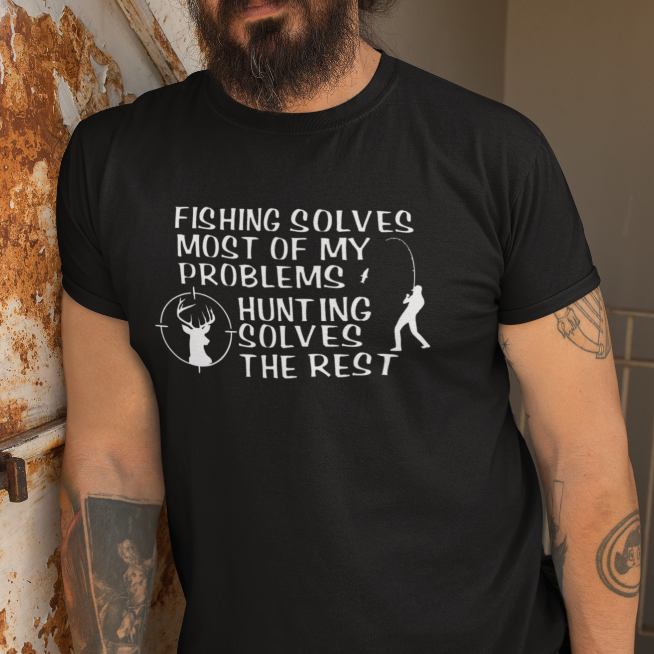 fishing-solves-most-of-my-problems-hunting-solves-the-rest-black-t-shirt-mockup-featuring-a-bearded-man-leaning-against-a-rusty-wall