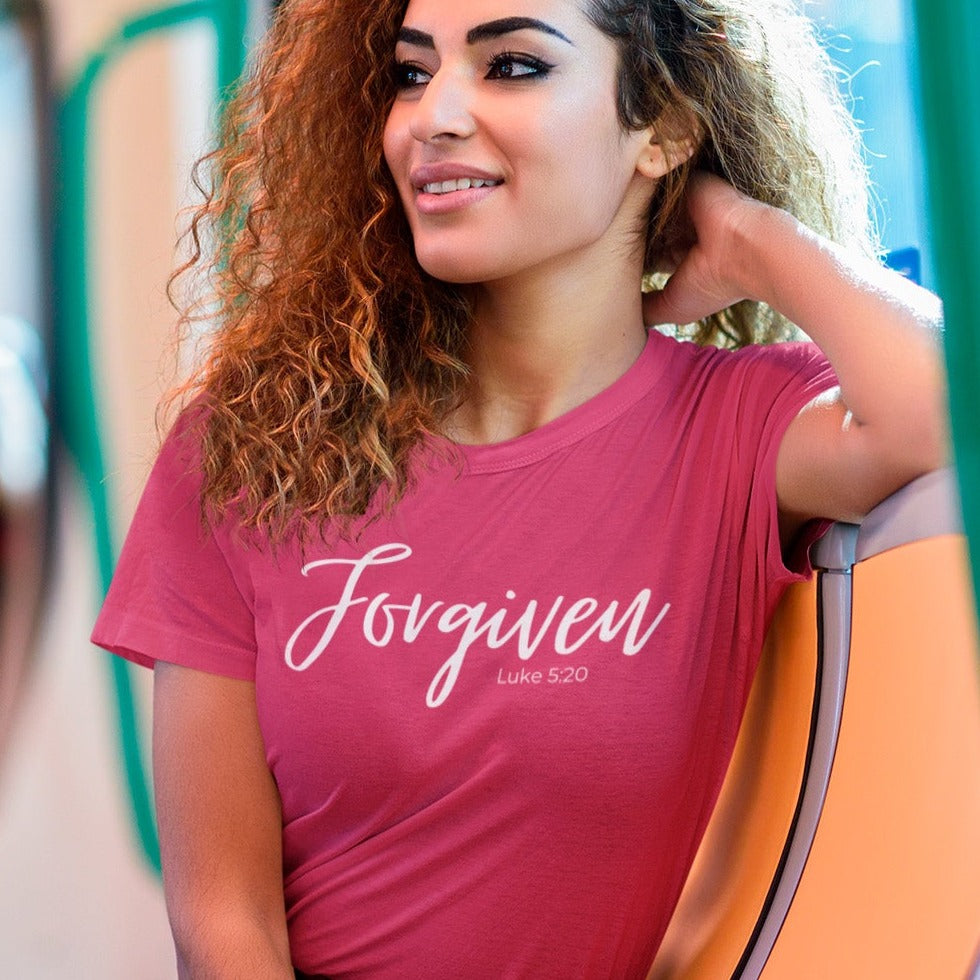 forgiven-luke-5-20-berry-t-shirt-unisex-inspiring-christian-mockup-of-a-woman-taking-the-subway-to-go-home