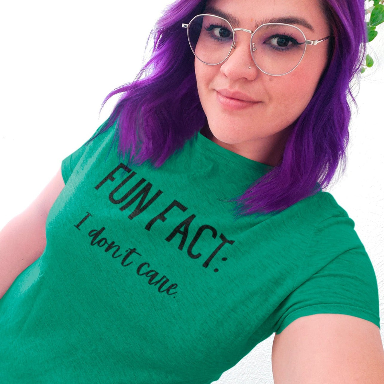 fun-fact-i-dont-care-funny-heatherd-kelly-t-shirt-womens-sarcastic-mockup-of-a-woman-with-purple-hair-taking-a-selfie