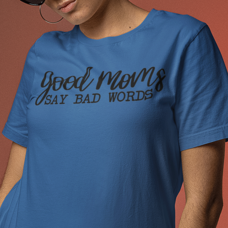 good-moms-say-bad-words-black-t-shirt-womens-tee-mockup-featuring-a-woman-posing-with-sunglasses-against-a-colored-background