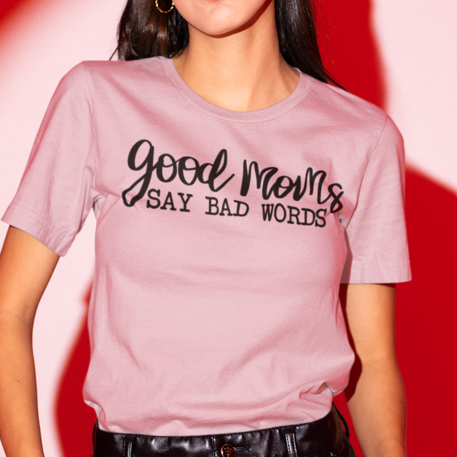 good-moms-say-bad-words-pink-t-shirt-womens-tee-bella-canvast-mockup-of-a-woman-posing-against-a-red-lighting