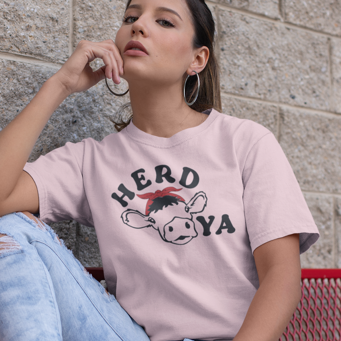 herd-ya-pink-t-shirt-cowgirl-mockup-of-a-trendy-woman-wearing-a-unisex-tee-and-distressed-jeans