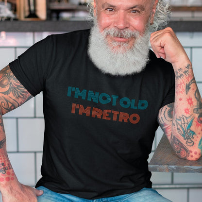 im-not-old-im-retro-black-t-shirt-mockup-of-a-tattooed-man-at-a-cafe