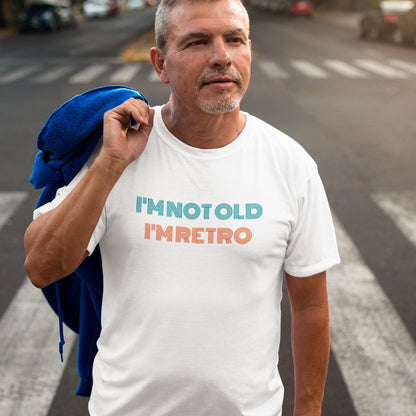 im-not-old-im-retro-white-t-shirt-mockup-featuring-a-man-standing-in-a-crosswalk