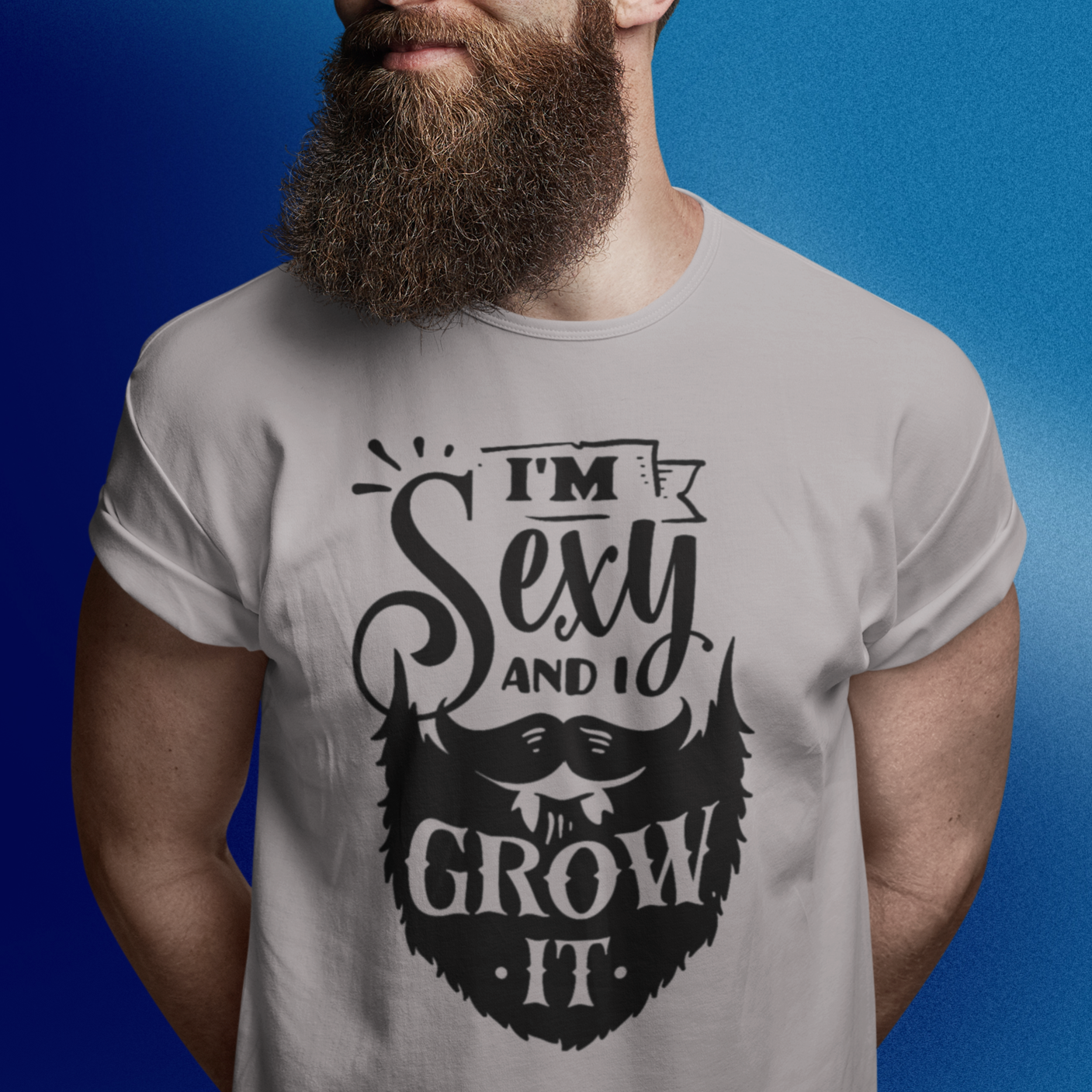 im-sexy-and-i-grow-it-athletic-heather-grey-mockup-of-a-bearded-man-wearing-a-t-shirt-in-a-studio