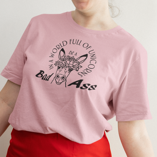 in-a-world-full-of-unicorns-be-a-bad-ass-pink-t-shirt-womens-funny-donkey-mockup-of-a-happy-woman-posing-with-her-valentine-s-day-outfit