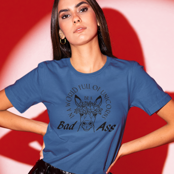 in-a-world-full-of-unicorns-be-a-bad-ass-true-royal-blue-t-shirt-womens-funny-donkey-bella-canvas-mockup-of-a-woman-with-leather-pants-posing-in-a-spotlight