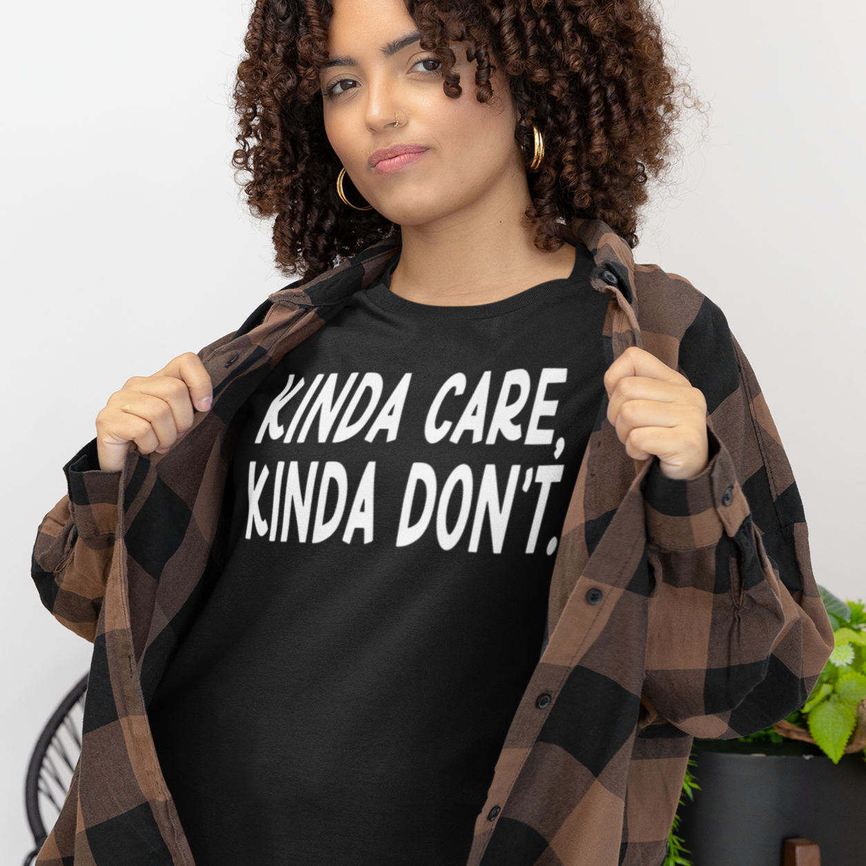 kinda-care-kinda-dont-bella-canvas-t-shirt-mockup-featuring-a-woman-with-curly-hair