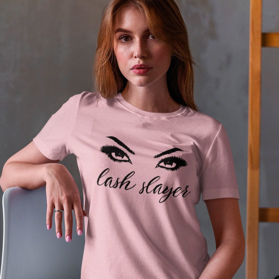 lash-slayer-pink-t-shirt-womens-fashion-mockup-of-a-blonde-woman-sitting-on-a-chair