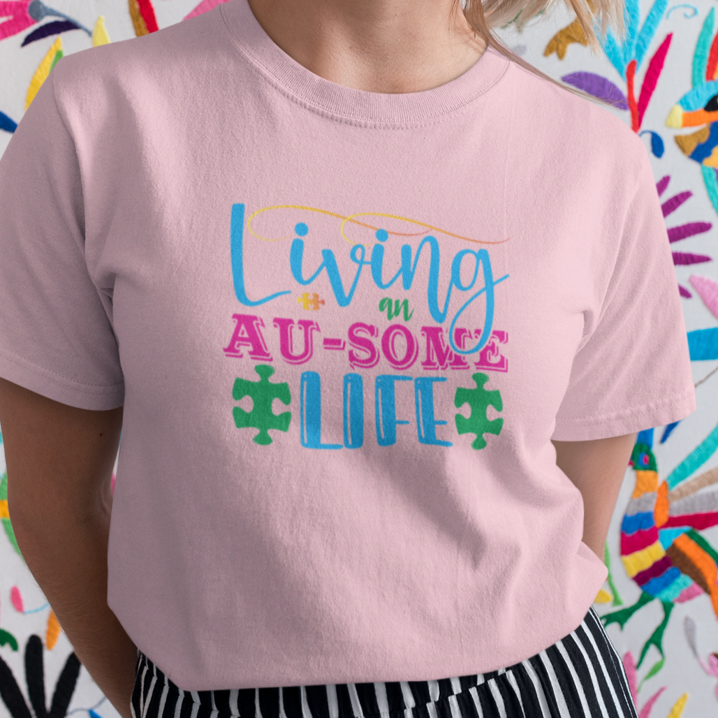 living-an-au-some-life-autism-awareness-month-pink-t-shirt-mockup-of-a-pretty-woman-smiling-in-front-of-a-colorful-background