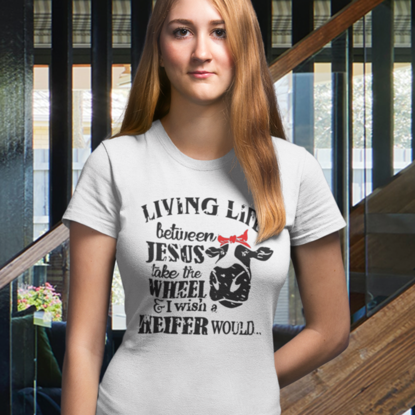 living-life-between-jesus-take-the-wheel-and-i-wish-a-heifer-would-white-t-shirt-transparent-mockup-of-the-front-view-of-a-blonde-woman-wearing-a-tee