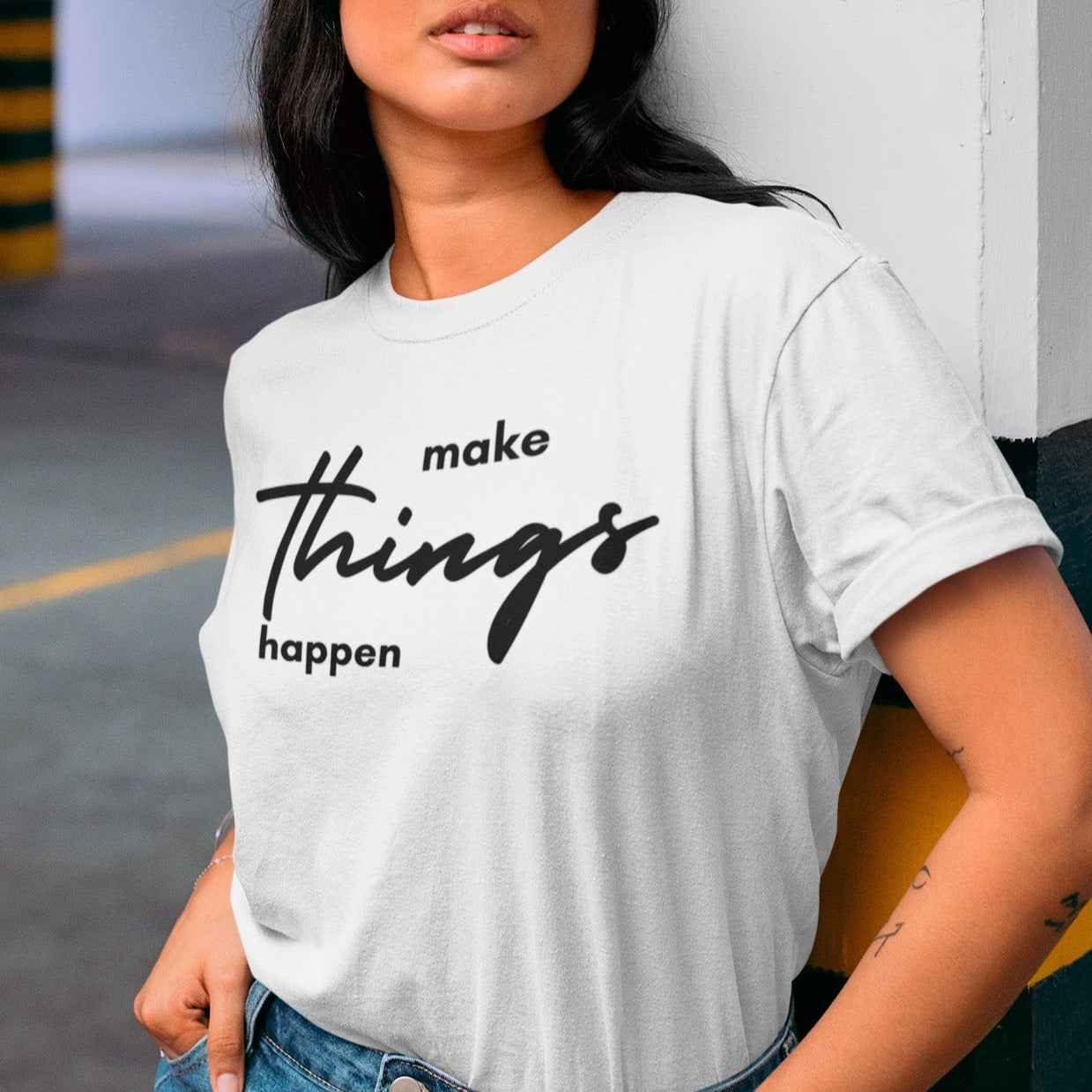 make-things-happen-white-t-shirt-women-inspiring-mockup-of-a-woman-wearing-a-tee-in-the-parking-lot