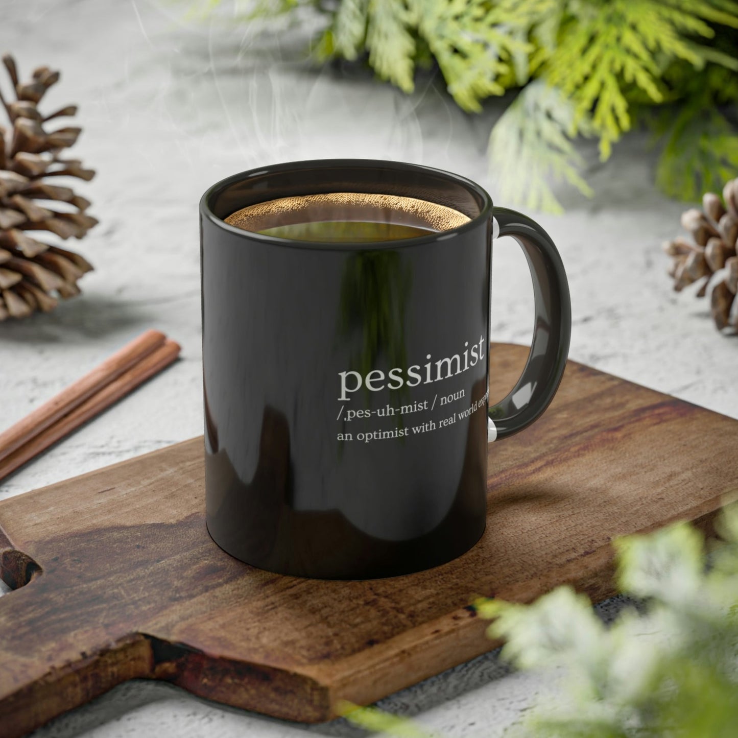 pessimist-definition-an-optimist-with-real-world-experience-glossy-mug-11-oz-orca-coating-on-a-cutting-board-view