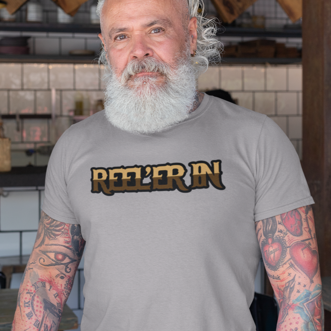 reeler-in-althletic-heather-grey-t-shirt-mockup-of-a-bearded-senior-with-tattooed-arms-fishing