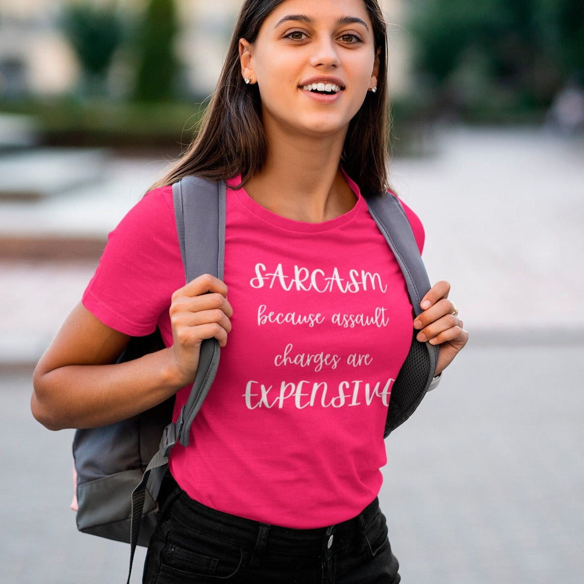 sarcasm-because-assault-charges-are-expensive-berry-t-shirt-women-funny-sarcastic-mockup-featuring-a-young-female-student