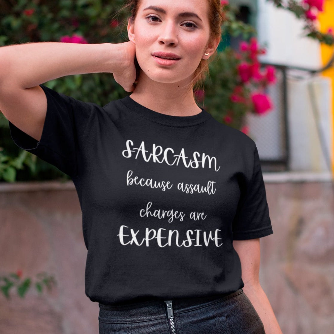 sarcasm-because-assault-charges-are-expensive-black-t-shirt-women-funny-tee-mockup-of-a-girl-in-a-leather-skirt-posing-by-a-street-with-flowers