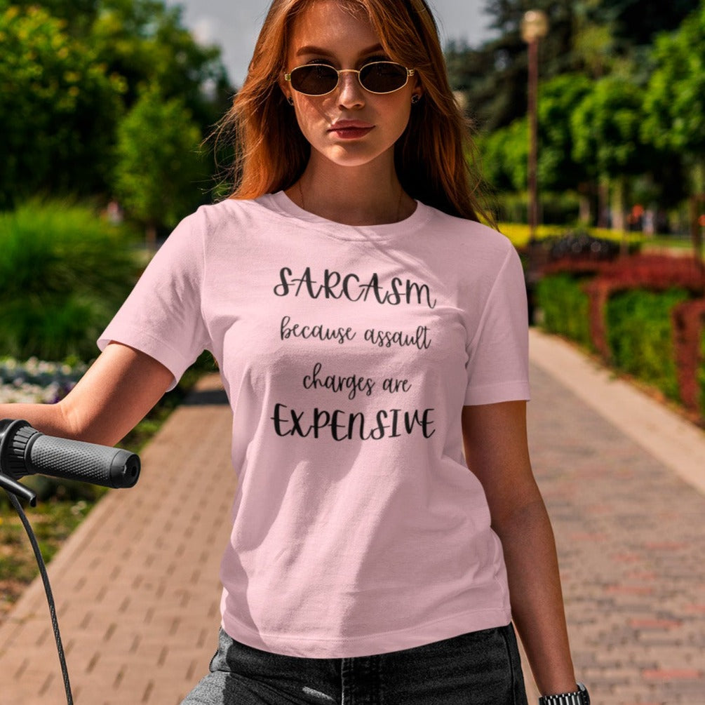 sarcasm-because-assault-charges-are-expensive-pink-t-shirt-women-funny-sarcastic-mockup-of-a-woman-using-a-scooter