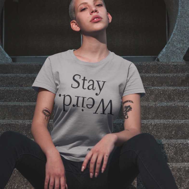 stay-weird-athletic-heather-grey-t-shirt-unisex-mockup-of-a-trendy-girl-with-tattoos-wearing-a-t-shirt-on-street-stairs
