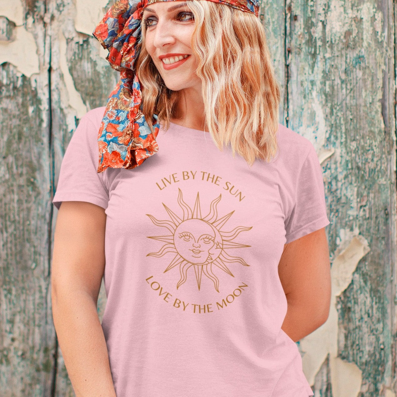 t-shirt-mockup-featuring-a-smiling-woman-posing-by-an-old-wooden-wall
