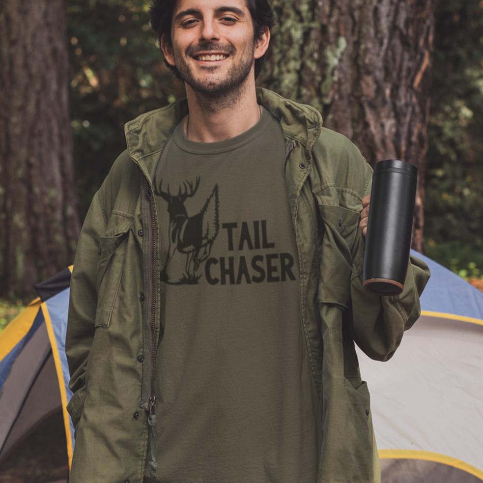 tail-chaser-army-green-t-shirt-mockup-of-a-man-camping-in-the-woods
