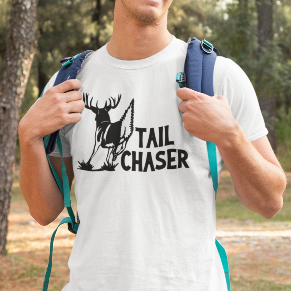 tail-chaser-t-shirt-mockup-featuring-a-smiling-man-hiking-at-the-woods