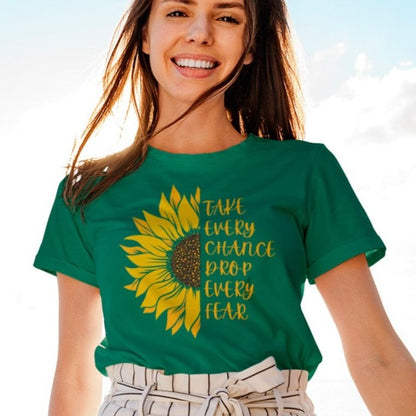 take-every-chance-drop-every-fear-heather-kelly-green-t-shirt-sunflower-mockup-featuring-a-smiling-woman-posing-on-a-yacht