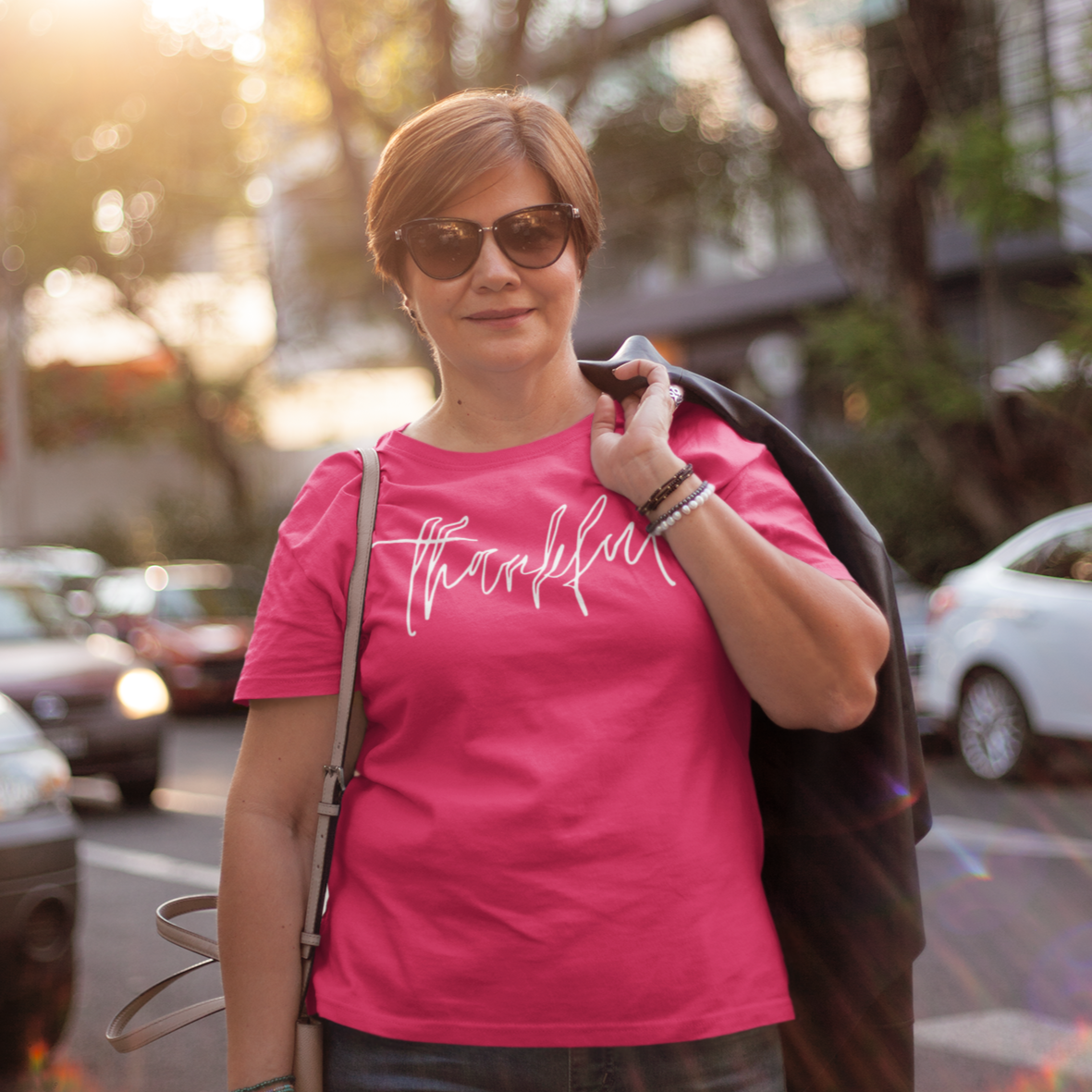 thankful-berry-t-shirt-womens-inspiring-middle-aged-woman-wearing-a-tee-mockup-carrying-a-jacket-on-her-back