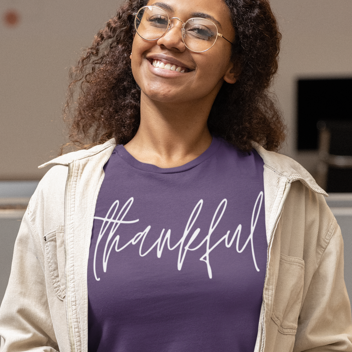 thankful-team-purple-t-shirt-womens-inspiring-mockup-of-a-happy-woman-wearing-a-bella-canvas-tee-and-a-jacket