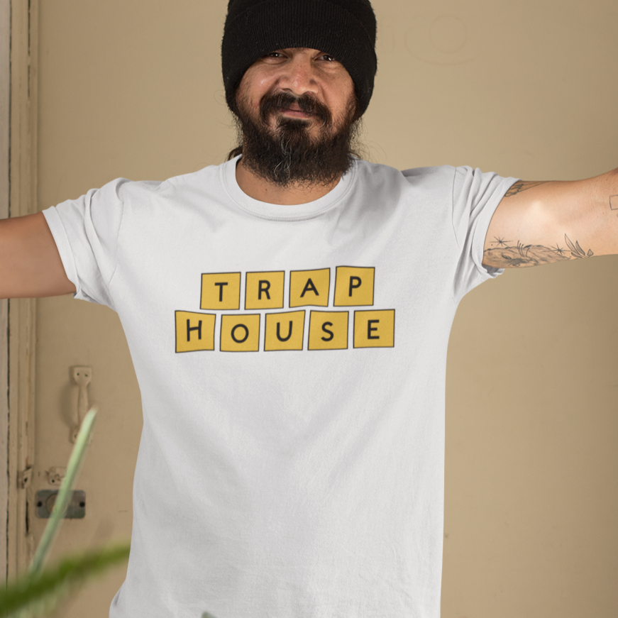 trap-house-mockup-of-a-tattooed-man-wearing-a-t-shirt-indoors
